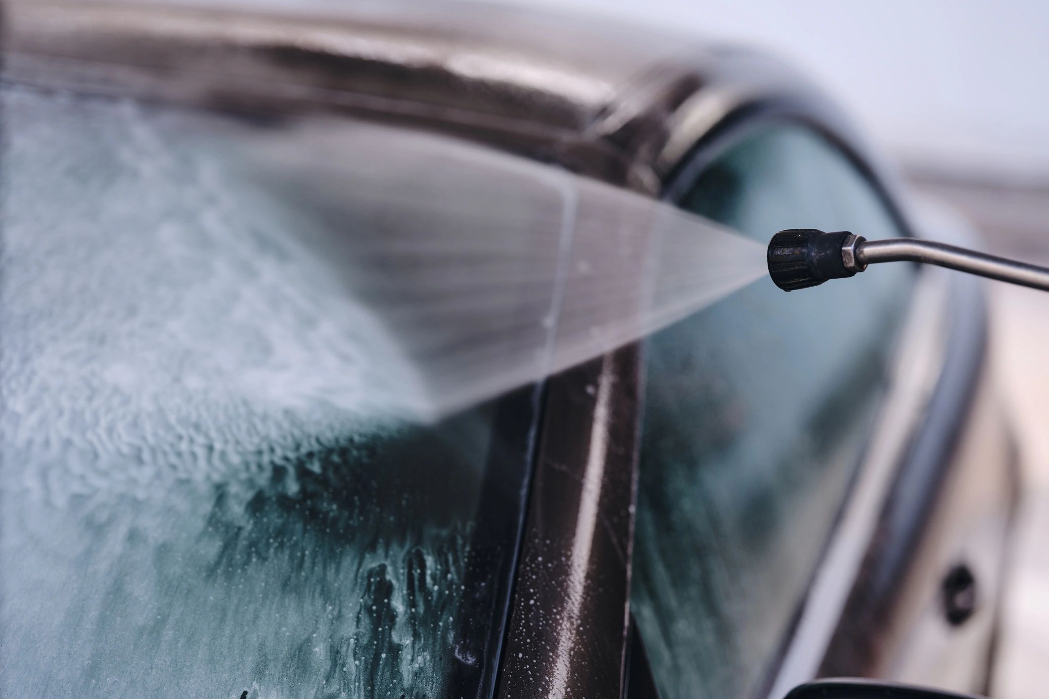 Close-up of car cleaning and paint-safe washing